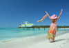 Woman on beach at Great Exuma, Bahamas (photo via astra490/iStock/Getty Images Plus)