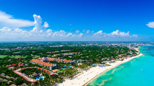 Playa del Carmen aerial view of the beautiful white sand beaches and blue turquoise water of the Caribbean ocean (Photo via HT-Pix / iStock / Getty Images Plus)