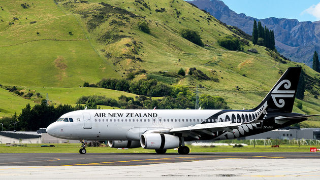 Airplane of Air New Zealand takes off from airport
