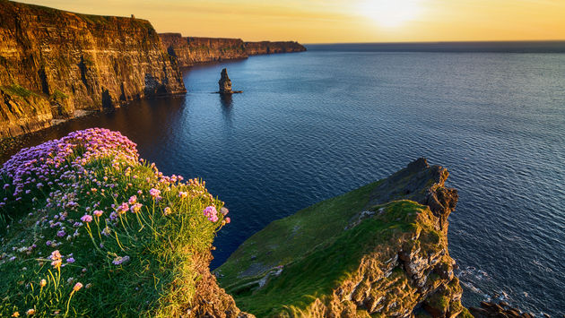 Sunset over the Cliffs of Moher in County Clare along Ireland's Wild Atlantic Way.