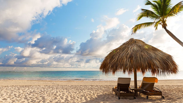 sand beach in Punta Cana, Dominican Republic (Photo via Preto_perola / iStock / Getty Images Plus)