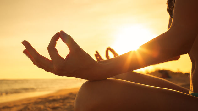 Enjoy early morning yoga on the beach.