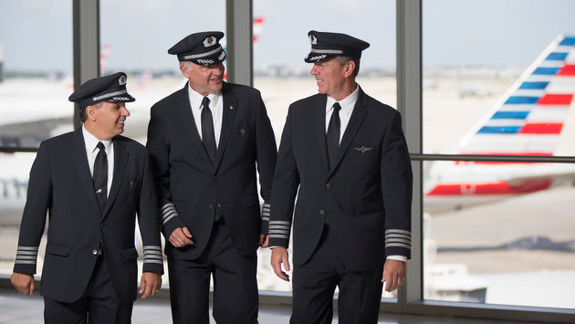 American Airlines pilots conversing at the gate