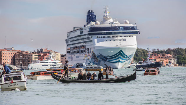 A cruise ship sailing through Venice, Italy