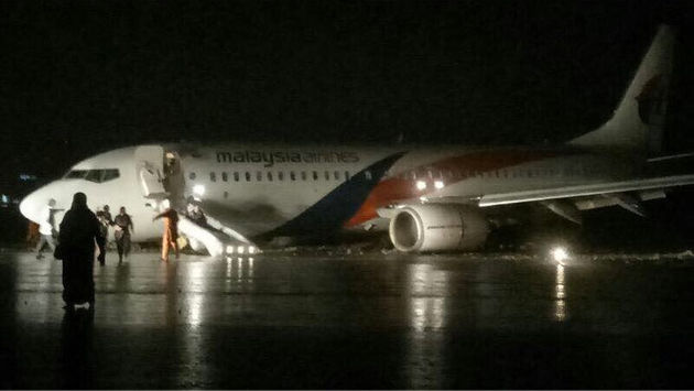 PHOTO: Malaysia Airlines flight MAS2718 skidded off the runway after attempting to land in a heavy downpour. (Photo courtesy of TravelPulse Canada)