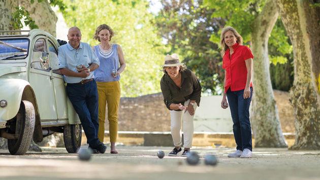 Travelers playing bocce ball