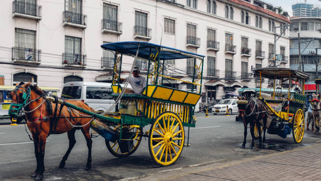 Ride a kalesa or horse-drawn carriage in Manila