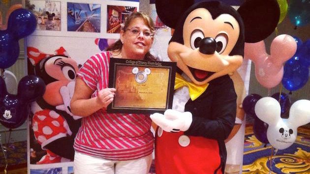 Travel agent Lori Wall being lauded by Mickey Mouse himself