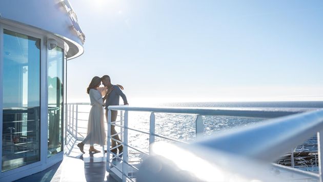 A couple enjoying a romantic moment aboard Seven Seas Navigator, Regent Seven Seas Cruises