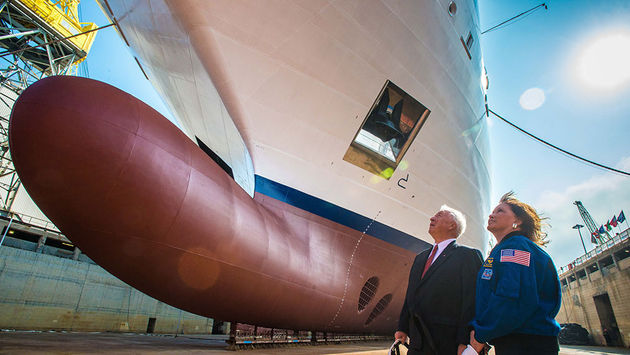 Viking Cruises Chairman Torstein Hagen and Dr. Anna Fisher look up at Viking Orion