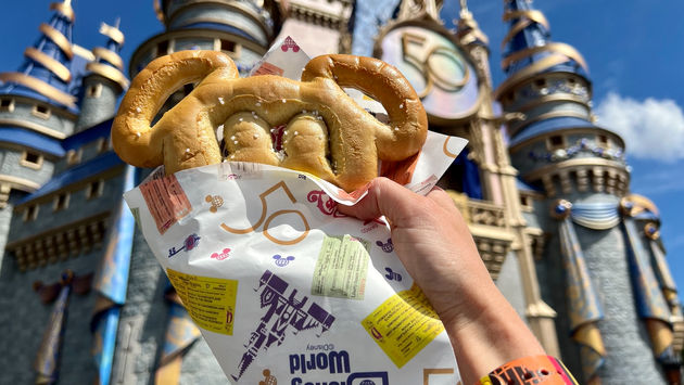Mickey pretzel wrapped in celebratory paper at Magic Kingdom