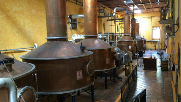 Tequila factories use traditional and modern techniques in world-class facilities. (Photo via Will McGough).