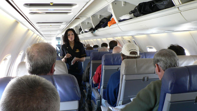 flight attendant talking passengers