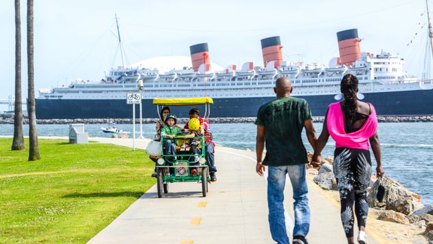 People tour the waterfront in Long Beach, California