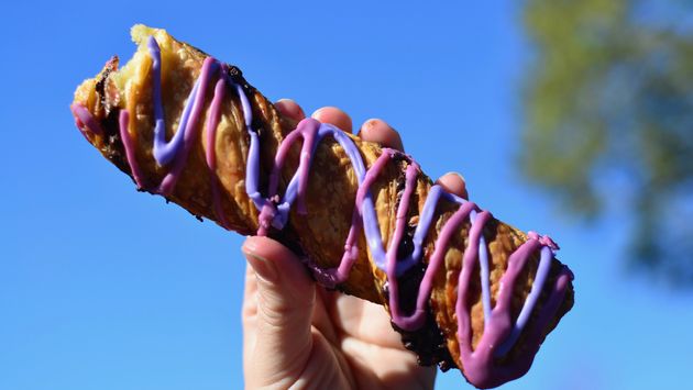 pastry with purple and pink frosting, Cheshire Cat Tail at Magic Kingdom