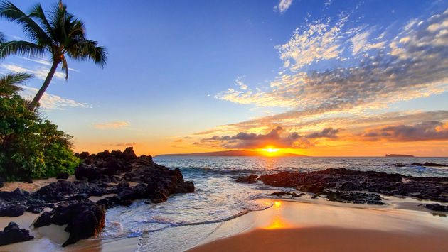 Makena Secret Beach at sunset in Maui, Hawaii.