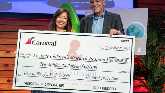 Christine Duffy presents ALSAC’s Richard Shadyac, Jr. with a  check for $10 million at St. Jude Children's Research Hospital.