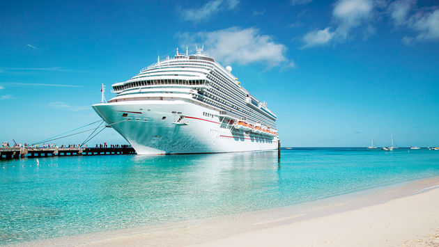 Cruise ship moored at Grand Turk island, the Caribbeans (Photo via mikolajn / iStock Editorial / Getty Images Plus)