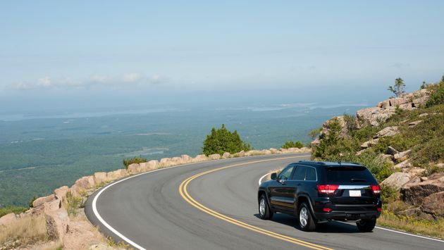 An SUV driving Cadillac Mountain in Maine's Acadia National Park