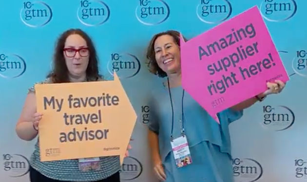 Travel advisor and supplier pose together at Global Travel Marketplace