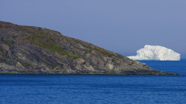 PHOTO: An iceberg floats past the coast of Newfound and Labrador along Iceberg Alley. (photo via Flickr/TravelingOtter)