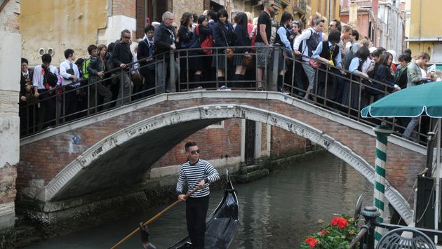 Editorial Use Only - Tourists in the crowded bridge in Venice, Italy