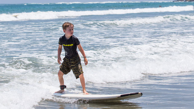 Son surfing in Costa Rica