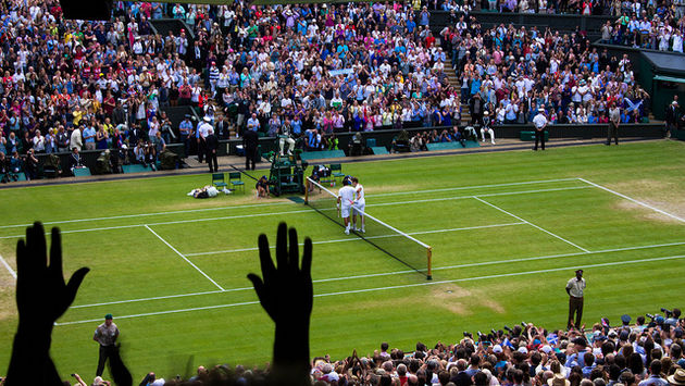 A quarter-final match ends at the famed Wimbledon tennis tournament
