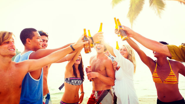 A group of friends celebrating on a tropical beach