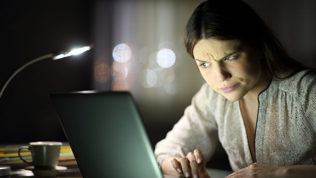 Woman reading a suspicious email.