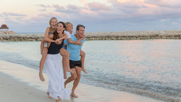 A family enjoying the beach in Riviera Maya