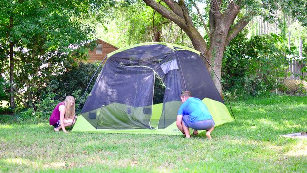 setting up tent, camping tent, woods