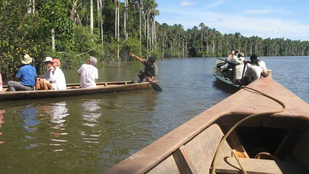 Brazil travelers are exploring areas beyond Rio de Janiero. Shown here is a canoe excursion in Brazil’s Tambopata National Reserve. (Photo by Brian Major)
