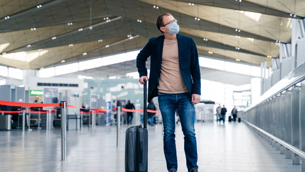 Traveler wearing a face mask at the airport