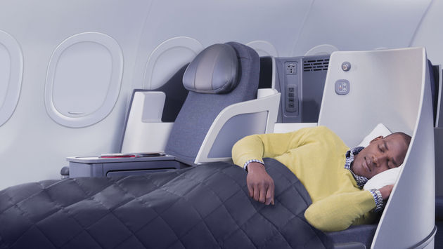 American Airlines passenger using First Class lie-flat seat