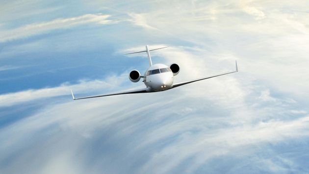 Private jet in the clouds