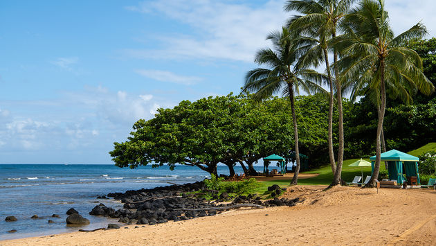 Sandy Beach in Princeville, Kauai Hawaii (PHOTO: Photo via rschlie / iStock / Getty Images Plus)