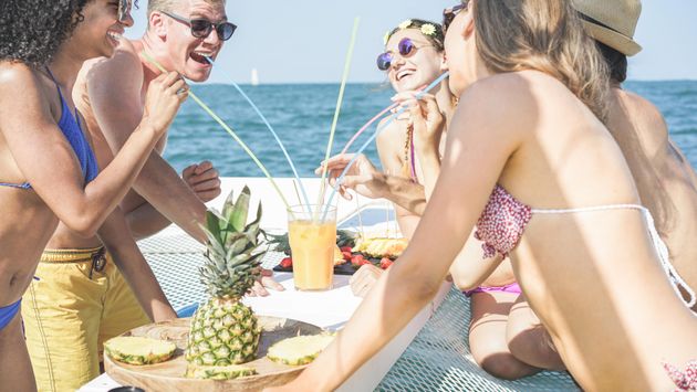 Friends eating fruit on boat