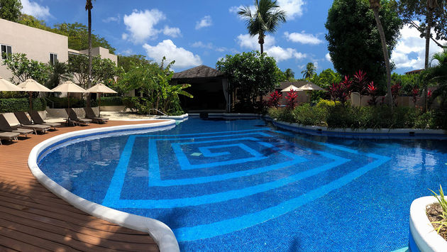 The adults-only pool at Waves Hotel & Spa is adjacent to the spa and is a quiet respite from the beach.