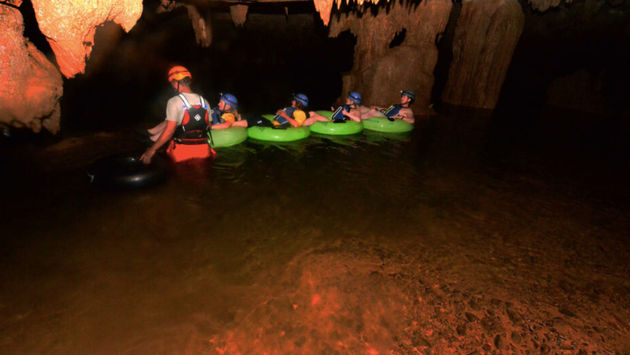 Cave tours are one of Belize's most exciting experiences. (Photo via Belize Tourism Board).