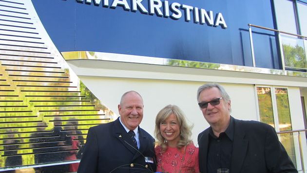 After the champagne bottle smashed against the hull, Kristin Karst posed with AmaWaterways co-founder Rudi Schreiner, right, and the ship’s captain.