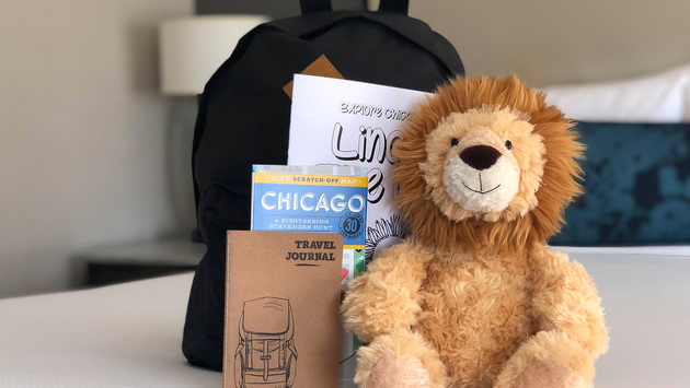 Plush lion with backpack and Chicago scavenger hunt booklet at Intercontinental Chicago