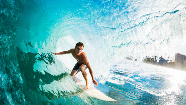 Close-up of a surfer in the tube getting barreled.