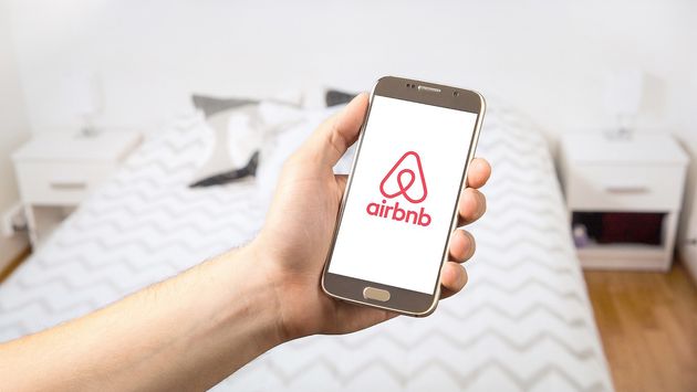 Airbnb logo on a smart phone screen