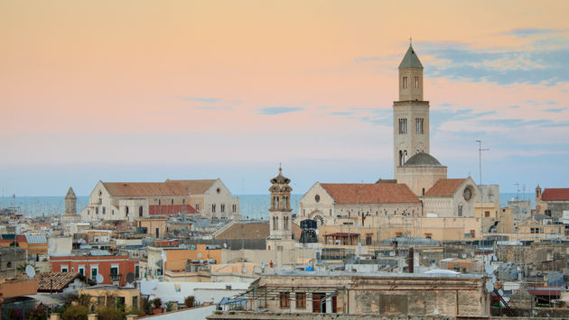 Cityscape of Bari at sunset with Basilica of San Nicola and Romanesque Cathedral