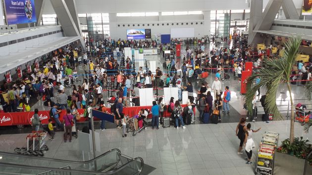 Passengers at the check-in counters inside of Ninoy Aquino International Airport in Manila, Philippines