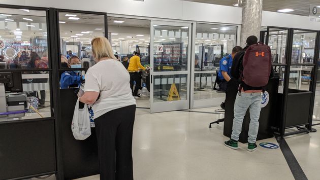 Travelers check in with TSA at Atlanta Airport