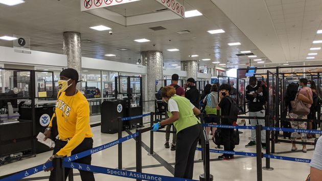Travelers waiting in the security line at the airport