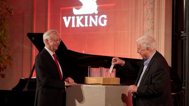 Viking Chairman Torstein Hagen pictured viewing a representation of Viking’s fleet with Meyer Werft’s Bernard Mayer during the Viking Longships Naming ceremony in Paris.