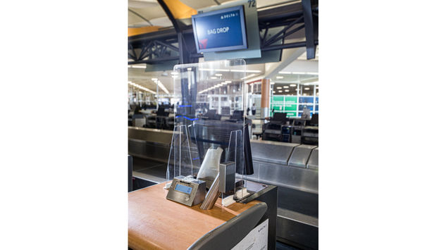 Delta Air Lines' custom plexiglass safety barriers.
